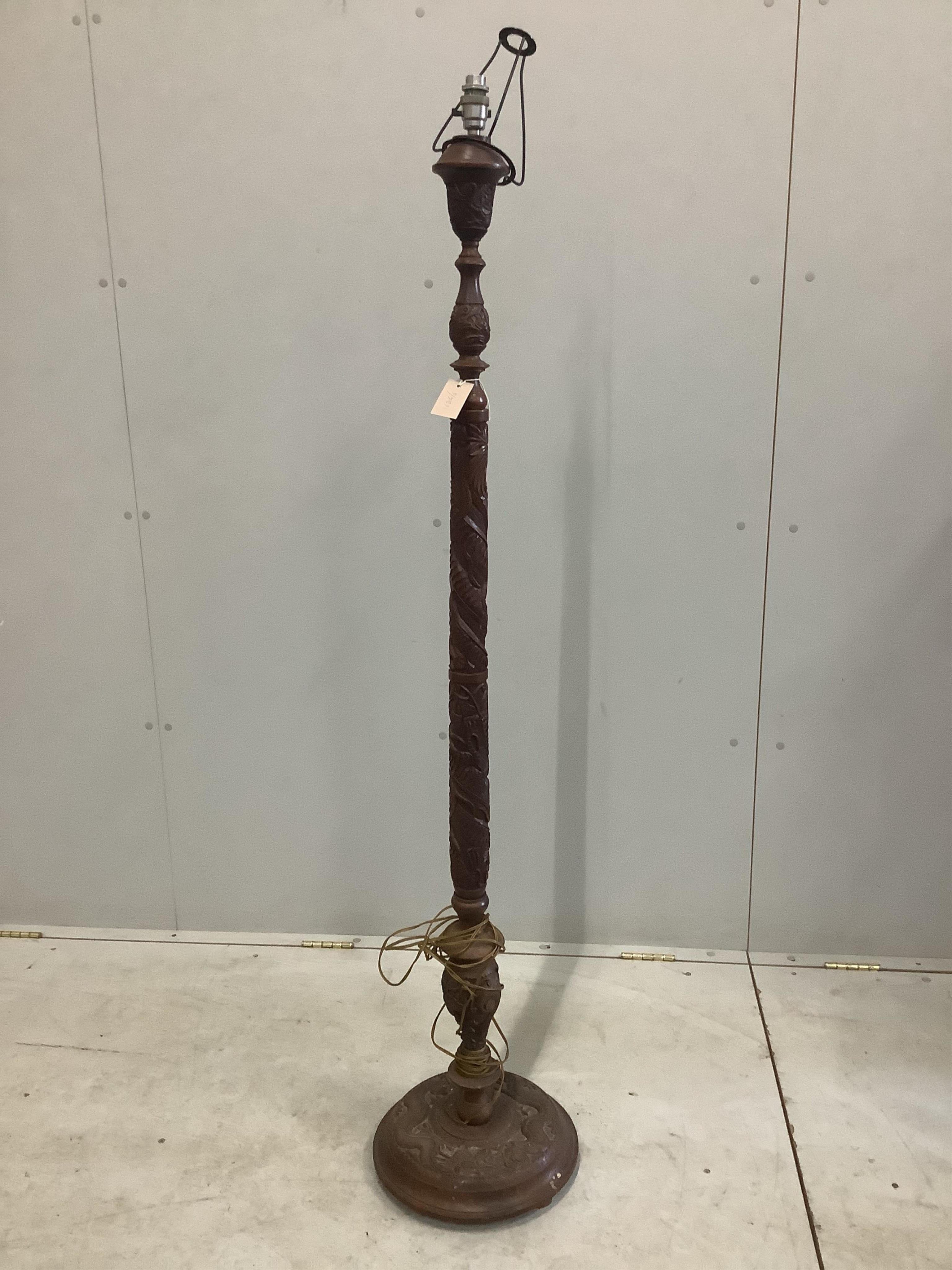 A 19th century Asian hardwood lamp standard carved with dragons, height 150cm, together with a carved mahogany torchere, height 100cm. Condition - fair